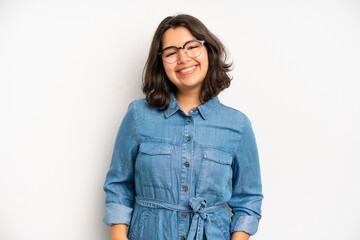 hispanic pretty woman smiling cheerfully and casually with a positive, happy, confident and relaxed...