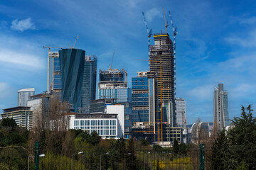 Skyscrapers and buildings under construction view from a public park in Istanbul. Istanbul financial center construction site.
