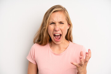 blonde pretty woman looking angry, annoyed and frustrated screaming wtf or what’s wrong with you