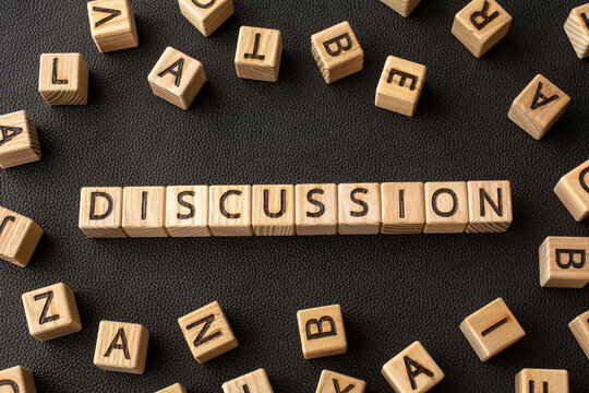 Discussion - word from wooden blocks with letters, DISCUSSION consideration question debate concept, random letters around black background
