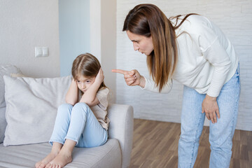 Quarrel between mother and daughter at home. The education of the child. mother scolds her child...