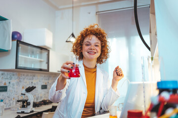 A female scientist examines samples in a laboratory, full of, state of the art research equipment....