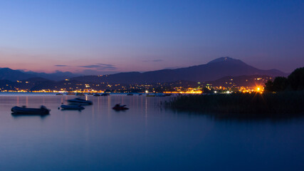 City with mountain in the background at Lago di Garda