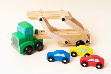 Toy tow truck towing damaged cars after a serious accident. Car traffic, car crash, dangerous...