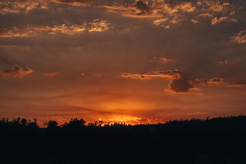 Fototapeta premium Beautiful Orange Purple Sunset over Mountains 