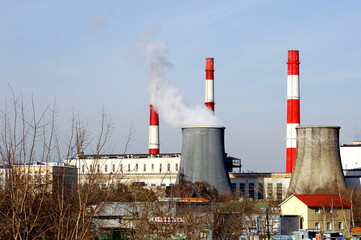 Thermal power plant in Moscow, cooling towers, pipes. Cityscape - industrial area