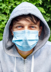 Young Man in the Surgical Mask