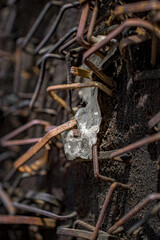 The telephone pole outside the ticket office in Woodstock NY is covered with staples that held posters of upcoming Concerts.  Rusted metal staples cover this pole.