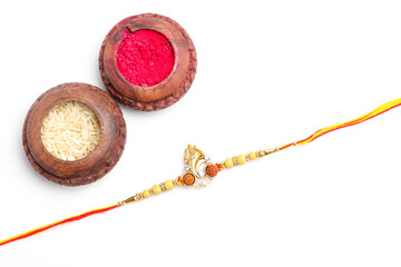 Indian festival: Raksha Bandhan. A traditional Indian wrist band on white background.