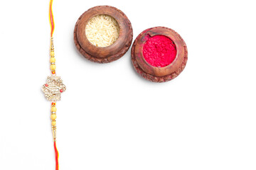 Indian festival: Raksha Bandhan. A traditional Indian wrist band on white background.