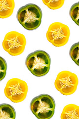 Sliced bell pepper pattern on a white background. Yellow and green salad fresh pepper. Vertical photo