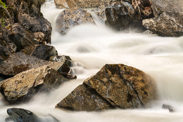 Rocks in a mountain stream taken with long time exposure