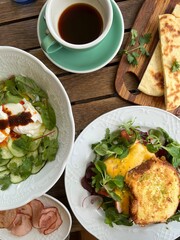 breakfast in cafe with coffee on wooden table top view