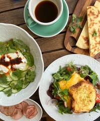 breakfast in cafe with coffee on wooden table top view