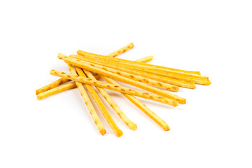 Random stack of corn snack sticks top down view isolated over white