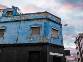 blue building with pink clouds