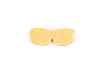Single unfrosted sunglasses sugar cookie isolated over white