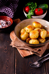 Fresh Cooked, new potatoes,with dill, on a wooden table, selective focus. close-up, toning, no people,