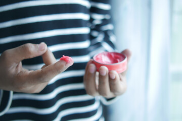  Close up of man hand using petroleum jelly 
