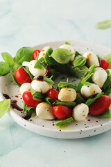 A plate with Italian salad caprese canape