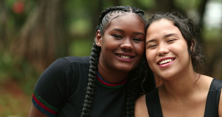 Naklejka premium Diverse girlfriends smiling at camera together. Ethnically diversity women