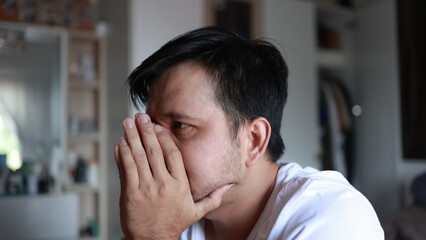 Fototapeta na wymiar portrait of asian man is worried and stressed.