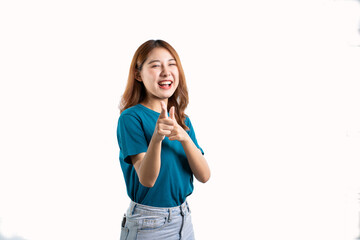 A graceful Asian woman smiles happily and points to a separate empty space on a white background.