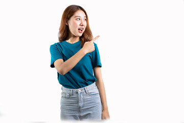 A graceful Asian woman smiles happily and points to a separate empty space on a white background.