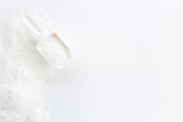 White washing powder with measuring scoop. Laundry day concept