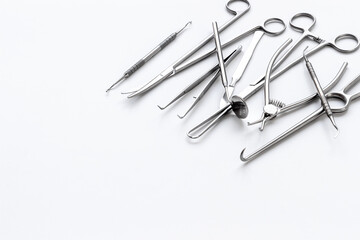 Stack of surgical medical steel equipment at surgery desk