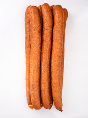 Country style smoked sausage in long rings, isolated. Traditional meat product, packshot photo for...
