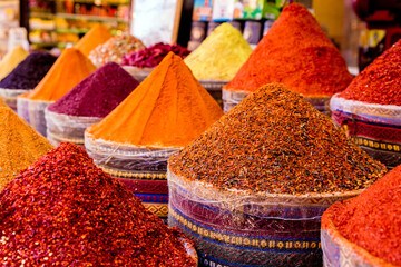 Spices Market with colourful mood. Multicolor spices sold at Egypt Bazaar (Misir Carsisi) in Istanbul, Turkey (Turkiye). Selected focus, copy space, colorful background - obrazy, fototapety, plakaty