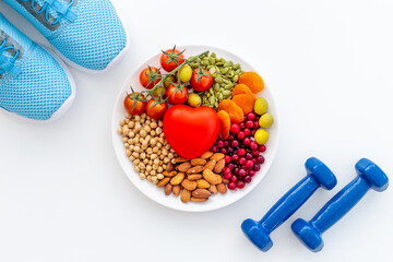 Healthy diet eating concept. Less fat more omega 3 food in plate with heart object