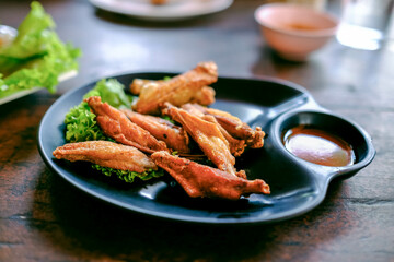 Crispy fried chicken wings on the plate.