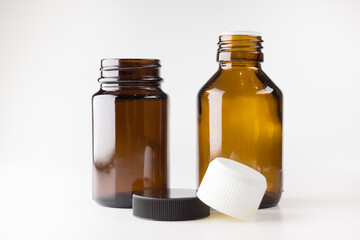 medical jars with dark glass caps