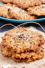 Fresh baked oatmeal cookies with honey and healthy seeds. Delicious crunchy dessert