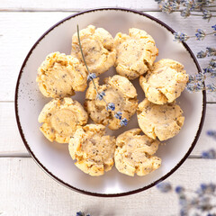 keto cookies on white wooden background decorated with lavender, top view