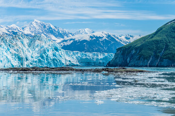 A view towards Russell Fjord with reflections of the Hubbard Glacier in Alaska in summertime