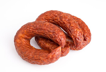 Rings of country style dry, smoked sausage, isolated. Polish meat sausage, a packshot photo for package design.