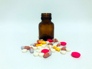 Medicine Pills or Tablets Drop and Out of the Brown Glass Bottle.