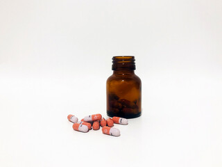 Medicine Pills or Tablets Drop and Out of the Brown Glass Bottle.