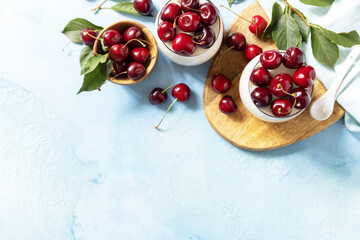 Panna cotta with sweet cherry jelly on a stone tabletop, italian dessert, homemade cuisine. View from above. Copy space.