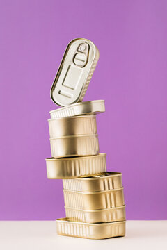 Set of stacked unopened cans