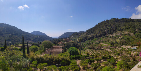 Panorama view of mountain and gardens in Valldemossa, Mallorca, Spain. Village in the valley surrounded by mountains.