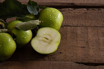 cut apple on old wooden table