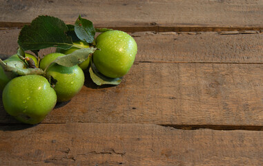 green apples on a wooden table