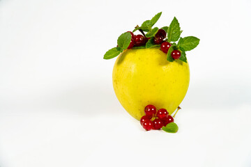 Green apple, red currant berries isolated on white background as package design element 