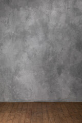 A dark empty space with wooden floors and gray plastered walls. Mock-up layout template for product demonstration or installation