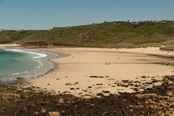 Sennen Cove, Cornwall, England, UK. 2022. Sennen Cove beach at low tide on a sunny day with clear blue sky in west Cornwall, UK