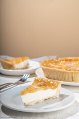 Homemade caramel apple pie cheesecake, sweet cheese  apple cake with caramelized apple sauce